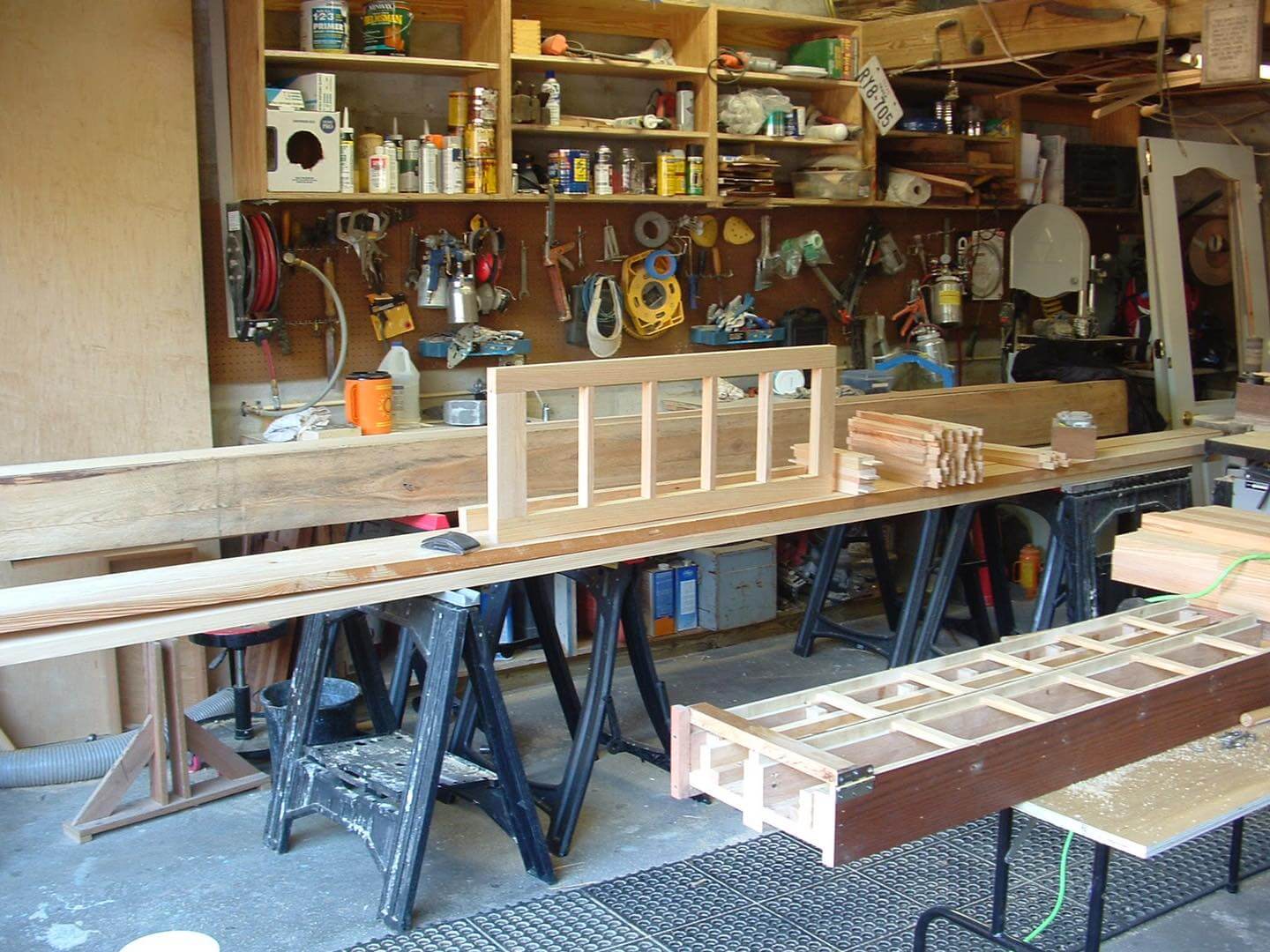 Wood window shop with sash and jigs in the background